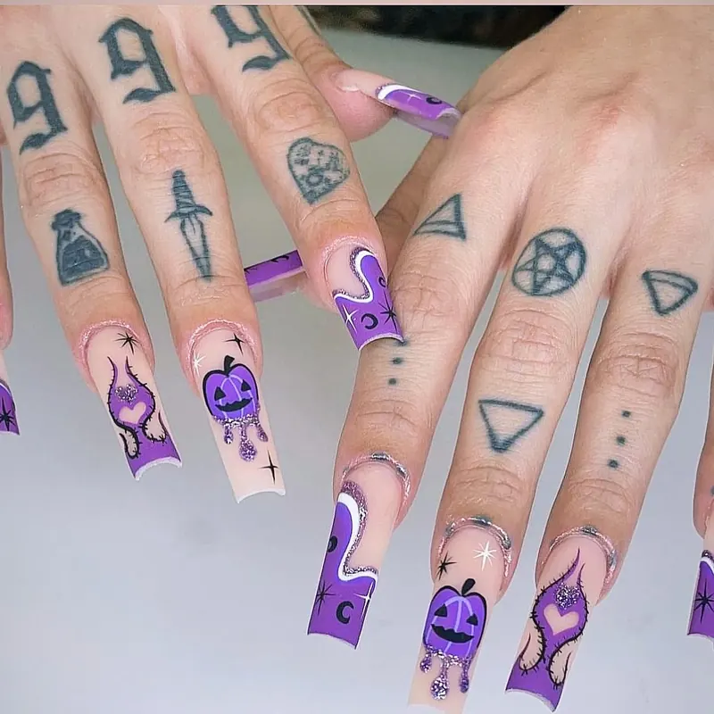 Purple drip French coffin nails with pumpkins, potion bottles and stars