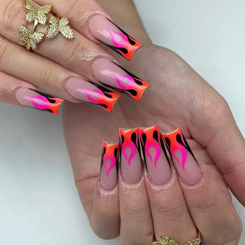 Coffin nails with hand-painted neon pink and orange flames
