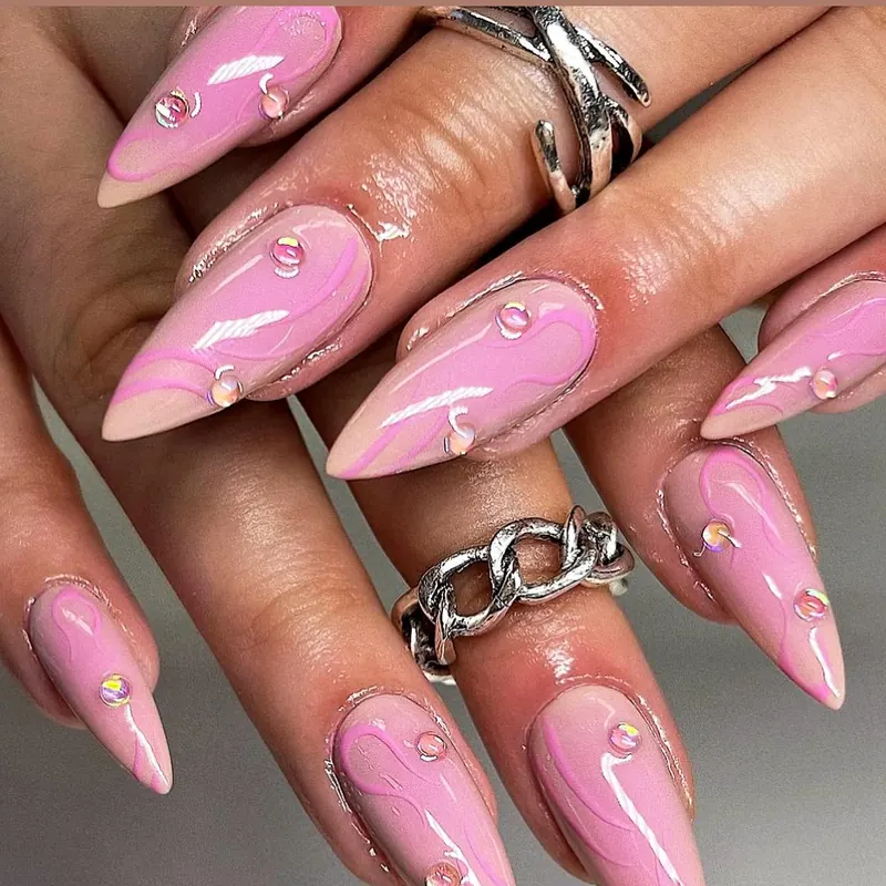 Bubblegum pink stiletto nails with 3D droplets and chrome swirls