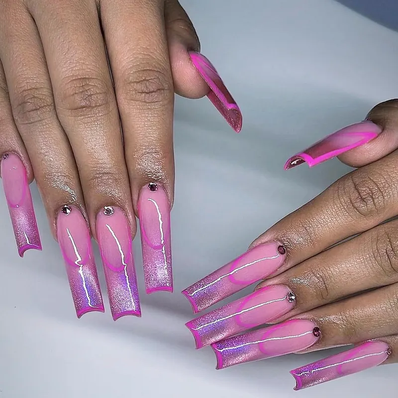 Square nails with a pink-to-violet glitter ombré and gold line accents