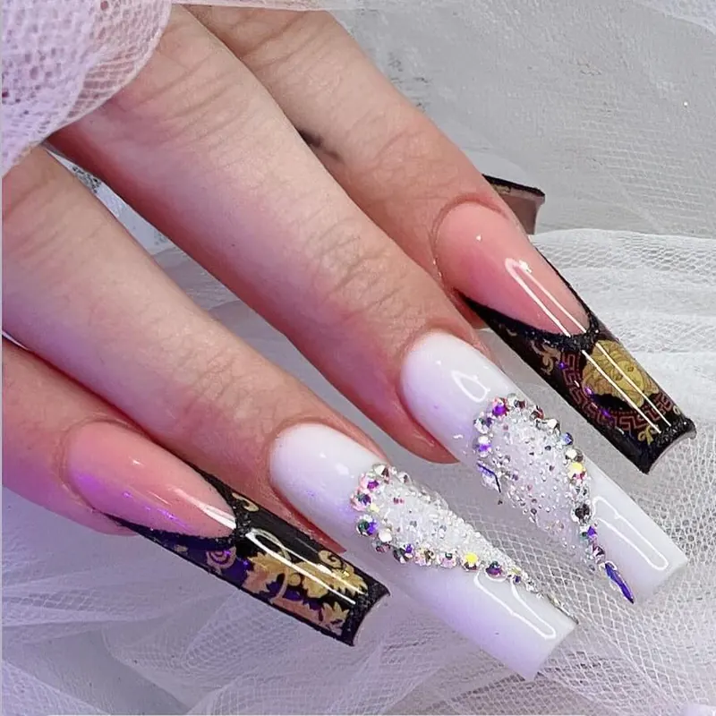 Coffin set in milky white and black with gold foil and a full crystal pavé nail