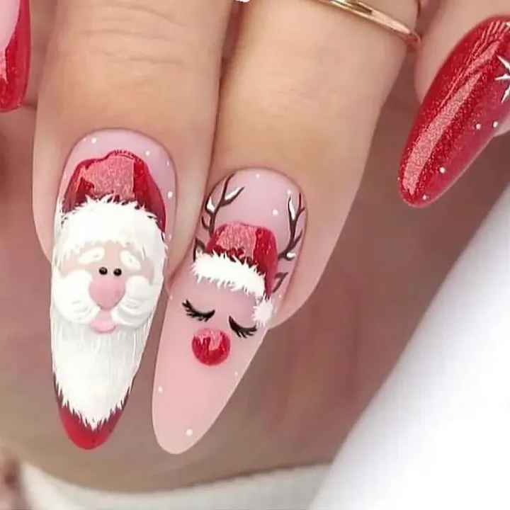 Almond nails with hand-painted Santa and reindeer faces and a red glitter accent